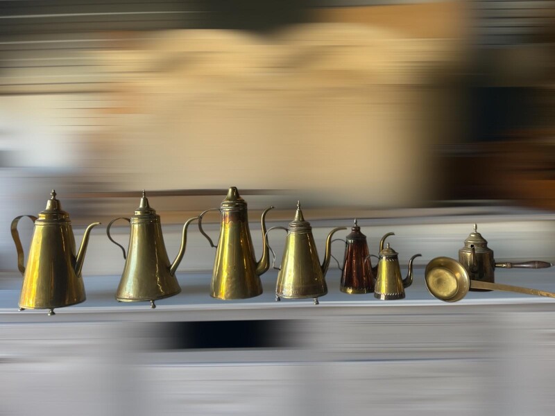 Set of assorted coffee pots and hot chocolate server with a ladle